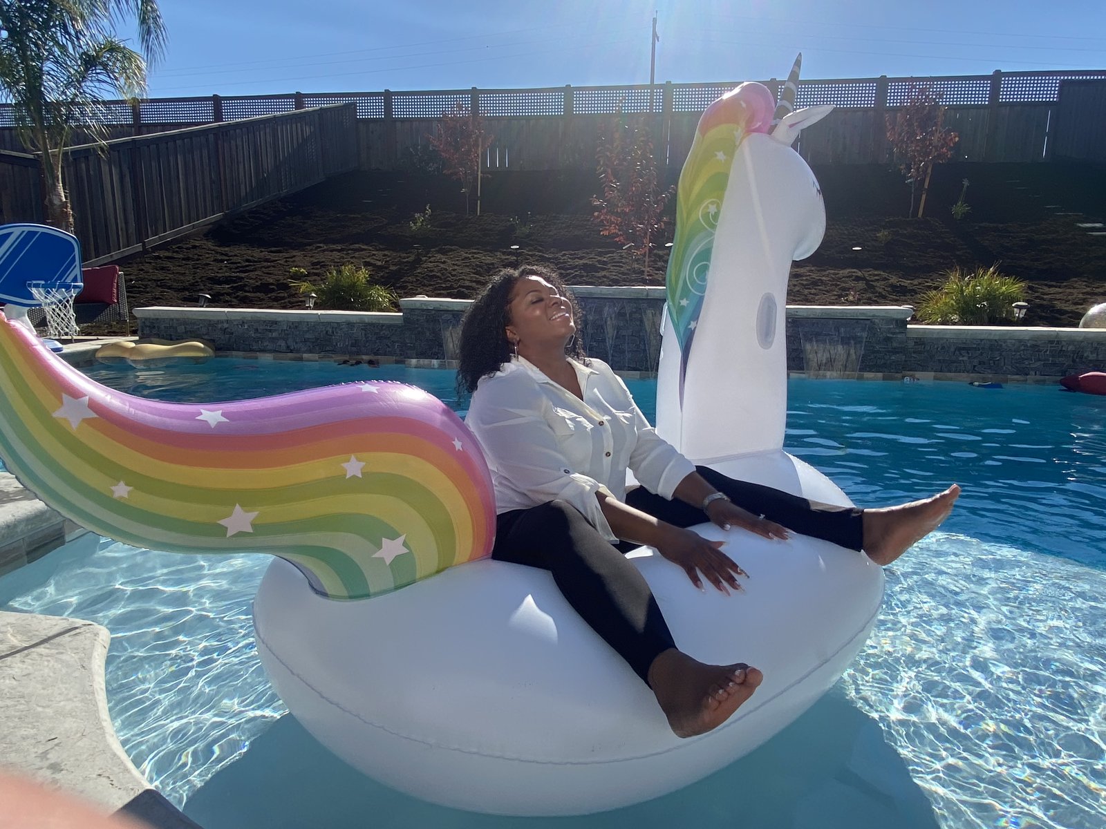 Michele on the float, arms wide